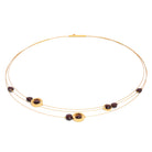 Collier Impuls von BERND WOLF aus 24-Karat-goldplattiertem Sterlingsilber mit Granat, Designlinie Facette.