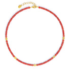 Halskette Marienella von BERND WOLF aus 24-Karat-goldplattiertem Sterlingsilber mit Wurzelkoralle, Designlinie Koru.