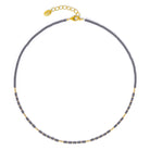 Halskette Tansa von BERND WOLF aus 24-Karat-goldplattiertem Sterlingsilber mit Hämatin matt, Designlinie Cleopatra.