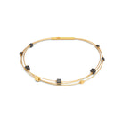 Armreif Lacuba von BERND WOLF aus 24-Karat-goldplattiertem Sterlingsilber mit Hämatin matt, Designlinie Cubes.